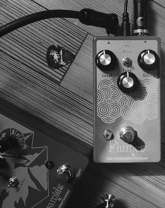 EarthQuaker Devices Plumes pedal, plugged in on the floor