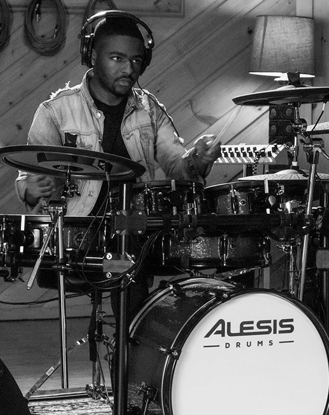 Person playing Alesis drums