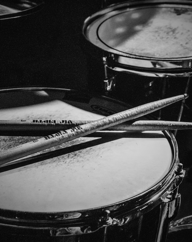 Vic Firth drumsticks sitting on a snare drum