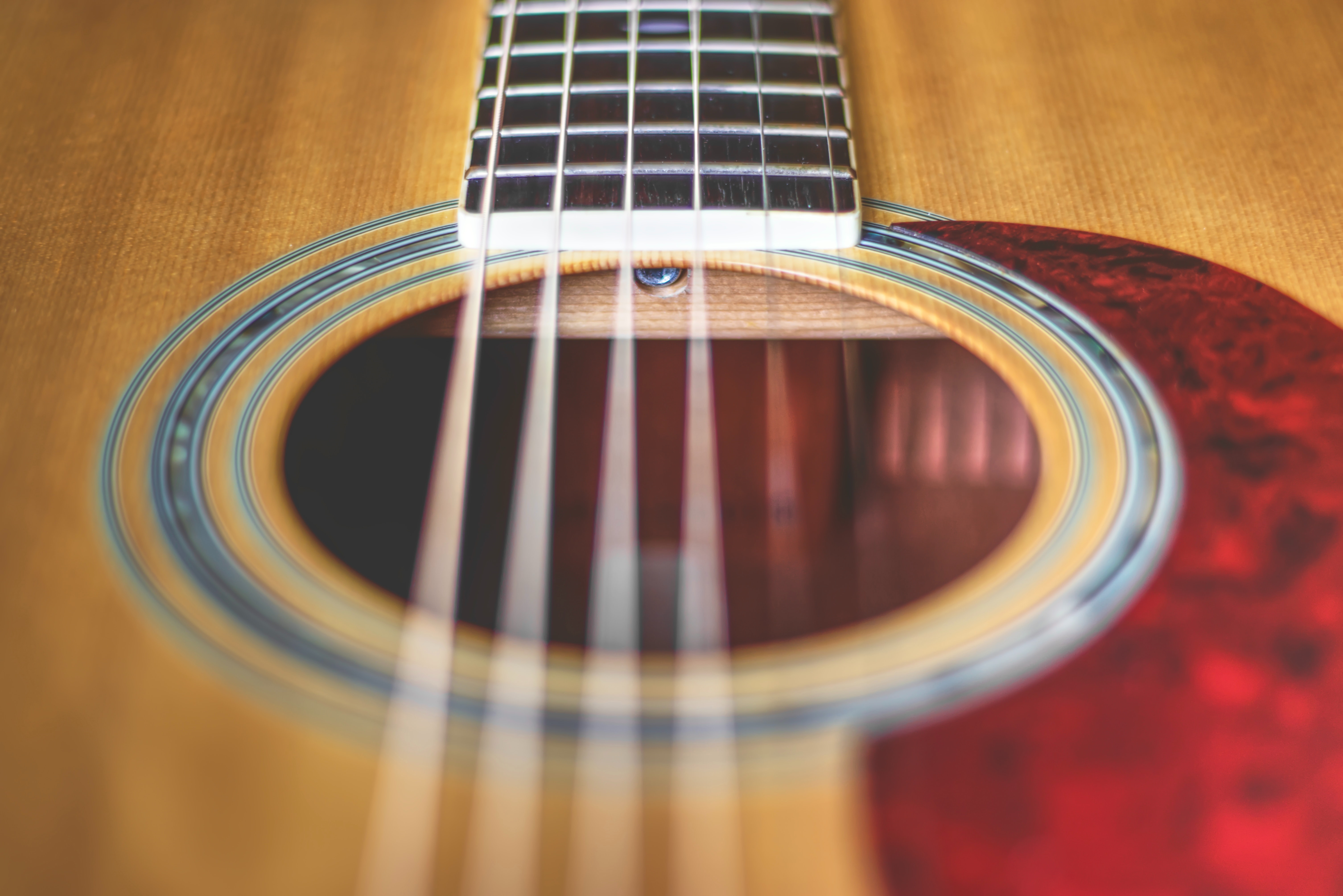 Close up of acoustic guitar sound hole.