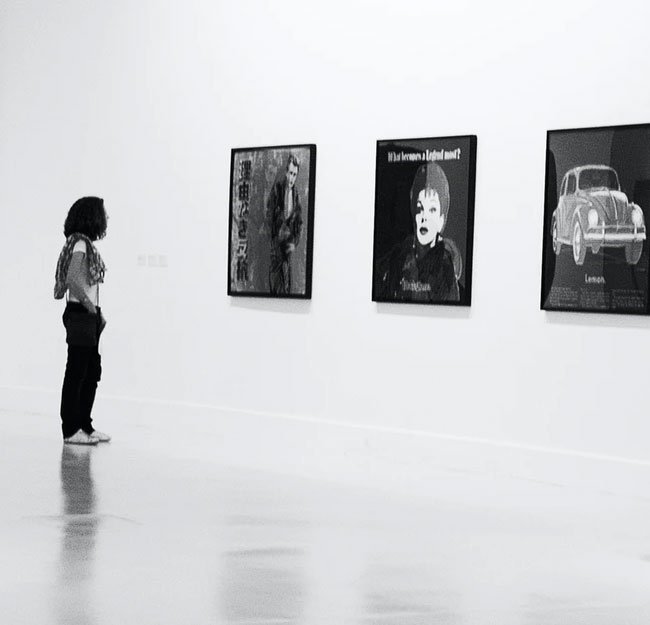 Person looking at art in a gallery