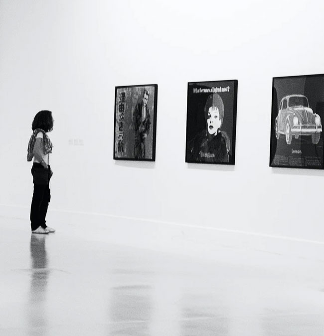 Person looking at art in a gallery
