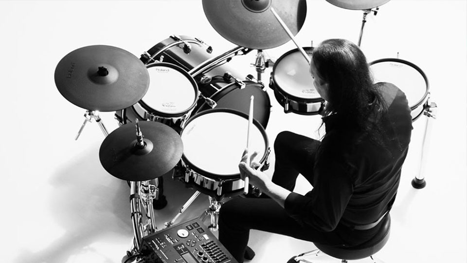 Drummer playing Roland V-drum kit