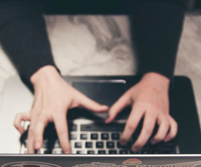 hands using a laptop